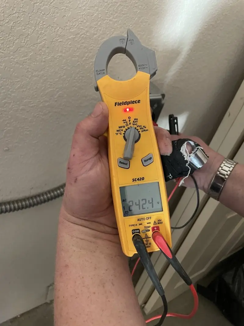 Voltage testing with clamp meter during Circuit Breaker Repair in Dix
